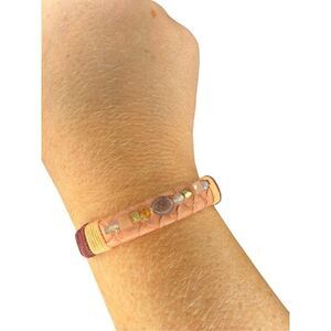 Boutique gold cuff with thread detail